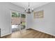 Dining area with sliding glass doors leading to an outdoor space and a stylish chandelier at 1080 Treymont Ln, Lawrenceville, GA 30045