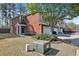View of the house with a brick facade, blue door, and well-maintained lawn area at 1080 Treymont Ln, Lawrenceville, GA 30045