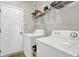 A simple laundry room area with both a washer and dryer at 1080 Treymont Ln, Lawrenceville, GA 30045