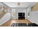 Bright living area showcasing hardwood floors, large windows, and a sleek entertainment center at 1080 Treymont Ln, Lawrenceville, GA 30045