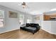 Cozy living area with hardwood floors, ample natural light, and stylish black leather furniture at 1080 Treymont Ln, Lawrenceville, GA 30045
