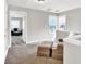 Open loft space with neutral walls and plush carpeting, seating at 1080 Treymont Ln, Lawrenceville, GA 30045