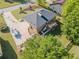 Aerial view of brick home with spacious driveway, boat, and large back deck at 458 Valley Woods Se Cir, Conyers, GA 30094