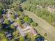 Aerial view of a neighborhood and a home with green grass in the back at 458 Valley Woods Se Cir, Conyers, GA 30094