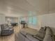 Basement living room with recessed lights and wainscotting; view of game room at 458 Valley Woods Se Cir, Conyers, GA 30094
