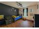 Bedroom with fun accents, laminate floors, ceiling fan, and plenty of natural light at 458 Valley Woods Se Cir, Conyers, GA 30094