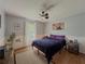 Bedroom with hardwood floors, neutral paint scheme, and a bright window at 458 Valley Woods Se Cir, Conyers, GA 30094