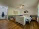 Bedroom with hardwood floors, stylish decor, and neutral paint scheme with half wall accent at 458 Valley Woods Se Cir, Conyers, GA 30094
