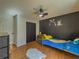Bedroom with laminate floors, bright decor, ceiling fan, and ample closet space at 458 Valley Woods Se Cir, Conyers, GA 30094