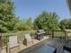 Back deck with furniture and grill overlooking yard at 458 Valley Woods Se Cir, Conyers, GA 30094