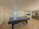 Finished basement game room with exterior door and view into recreation space at 458 Valley Woods Se Cir, Conyers, GA 30094