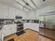 Well-lit kitchen featuring stainless steel appliances, granite countertops, and white cabinetry at 458 Valley Woods Se Cir, Conyers, GA 30094