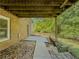 Covered outdoor patio and backyard with swing at 458 Valley Woods Se Cir, Conyers, GA 30094