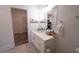 Bright bathroom with white cabinetry, quartz countertop, and modern fixtures at 525 Parkway Ne Dr # 103, Atlanta, GA 30308