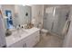 Beautiful bathroom with quartz countertops, white cabinets, and glass-enclosed shower at 525 Parkway Ne Dr # 103, Atlanta, GA 30308