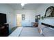 This primary bedroom features neutral walls, double closets, wood-look floors, and desk area at 525 Parkway Ne Dr # 103, Atlanta, GA 30308