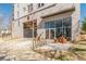 Modern condominium entrance with glass door, gray concrete and metallic awning at 525 Parkway Ne Dr # 103, Atlanta, GA 30308