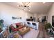 Cozy living room and kitchen with modern lighting, decor, and stainless appliances at 525 Parkway Ne Dr # 103, Atlanta, GA 30308