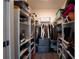 Walk-in closet with ample shelving and space for clothes and storage at 525 Parkway Ne Dr # 103, Atlanta, GA 30308