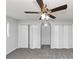 Bedroom featuring gray walls, gray carpet, and a ceiling fan and light at 5415 Orly Ter, Atlanta, GA 30349
