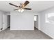 Bedroom featuring carpeting, fan, and light fixture and access to other rooms at 5415 Orly Ter, Atlanta, GA 30349