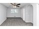 Bedroom features include carpeting and a ceiling fan with arched doorway access at 5415 Orly Ter, Atlanta, GA 30349
