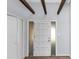 The entryway has new paint, wood floors and a contemporary front door with sidelights at 5415 Orly Ter, Atlanta, GA 30349