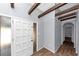 Inviting entryway with wood floors, high ceiling, wooden beams and modern gray walls at 5415 Orly Ter, Atlanta, GA 30349