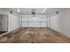 Large garage with unfinished floor and door to inside of the house at 5415 Orly Ter, Atlanta, GA 30349