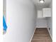 Neutral colored hallway featuring vinyl plank flooring and a window at 5415 Orly Ter, Atlanta, GA 30349