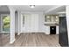 A modern kitchen featuring stainless steel appliances and access to an outdoor deck at 5415 Orly Ter, Atlanta, GA 30349