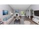 Stylishly furnished living room with fireplace, modern furniture and new floors at 5415 Orly Ter, Atlanta, GA 30349