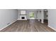 Spacious living room with modern flooring, fireplace, and an open concept layout at 5415 Orly Ter, Atlanta, GA 30349
