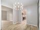 Open dining room showcasing modern lighting and seamless flow to living room and kitchen at 2544 Peyton Woods Sw Trl, Atlanta, GA 30311