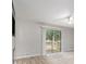 Bright living room featuring wood floors and sliding glass doors to a deck at 2544 Peyton Woods Sw Trl, Atlanta, GA 30311