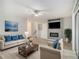 Well-decorated living space with comfortable furnishings, stylish decor, and a modern ceiling fan at 2544 Peyton Woods Sw Trl, Atlanta, GA 30311