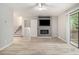 Bright living room with ceiling fan, TV, and sliding glass doors to deck at 2544 Peyton Woods Sw Trl, Atlanta, GA 30311