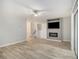 Open living space with modern ceiling fan and television built into modern entertainment center at 2544 Peyton Woods Sw Trl, Atlanta, GA 30311