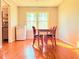 An interior view of the dining room, featuring a table and chairs and a small refrigerator at 2563 Hamill Dr, Buford, GA 30519