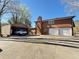 View of the detached garage and a white car sitting in the driveway at 2563 Hamill Dr, Buford, GA 30519