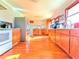Bright kitchen with stainless steel appliances, wooden cabinets, and hardwood flooring throughout the room at 2563 Hamill Dr, Buford, GA 30519