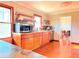 Spacious kitchen with stainless steel appliances, wooden cabinets, and hardwood flooring throughout the room at 2563 Hamill Dr, Buford, GA 30519