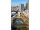 An aerial view showcasing the community's central park, and pond in a picturesque city setting at 400 17Th Nw St # 1113, Atlanta, GA 30363