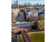 An aerial view of a city neighborhood featuring townhouses, a pond, and a scenic bridge at 400 17Th Nw St # 1113, Atlanta, GA 30363