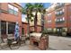 Outdoor grill area with brick accents, palm trees and a dining set at 400 17Th Nw St # 1113, Atlanta, GA 30363