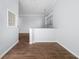 Hallway between rooms with stylish tile flooring and a half wall at 400 17Th Nw St # 1113, Atlanta, GA 30363