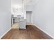 Open-concept living space with a view of the kitchen, with stainless appliances and granite countertops at 400 17Th Nw St # 1113, Atlanta, GA 30363