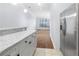 Kitchen area showcasing granite countertops, stainless refrigerator, and modern finishes at 400 17Th Nw St # 1113, Atlanta, GA 30363
