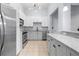 Bright kitchen with stainless steel appliances, white cabinets, and granite countertops at 400 17Th Nw St # 1113, Atlanta, GA 30363
