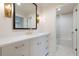 Bathroom with marble countertops, vanity, gold hardware, and a view of the tiled shower at 1 Mooregate Sq, Atlanta, GA 30327